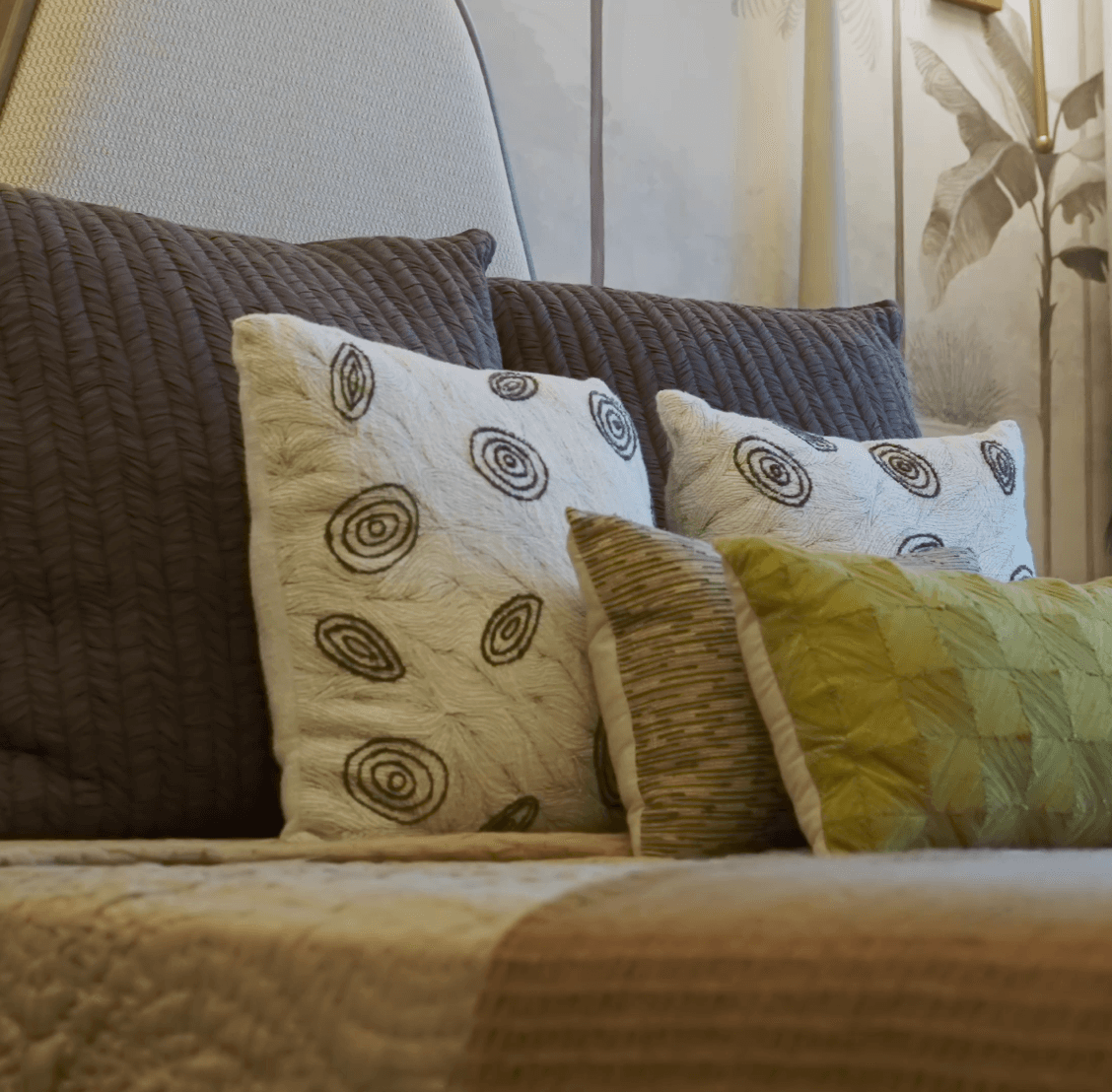 Thoughtfully layered embroidered cushions and textiles